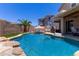 Beautiful private backyard pool with basketball hoop, desert landscaping, and patio at 3692 N 292Nd Dr, Buckeye, AZ 85396