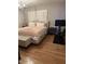 A spacious main bedroom with light hardwood floors and lots of natural light at 4020 N 44Th Pl, Phoenix, AZ 85018