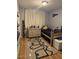 Neutral bedroom with twin bed, dresser, laminate flooring and window at 4020 N 44Th Pl, Phoenix, AZ 85018
