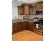 Modern kitchen with stainless steel appliances, granite countertops, and wooden cabinetry at 4020 N 44Th Pl, Phoenix, AZ 85018