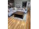 Inviting living room with a large sectional sofa, stylish coffee table, and hardwood floors at 4020 N 44Th Pl, Phoenix, AZ 85018