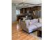Comfortable living space seamlessly connecting to the kitchen, featuring a sectional sofa and hardwood floors at 4020 N 44Th Pl, Phoenix, AZ 85018