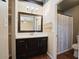 Bathroom featuring wood-look floors, a vanity, mirror, and shower with a curtain at 4415 S Poplar St, Tempe, AZ 85282