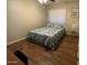 Comfortable bedroom featuring a ceiling fan and large window with natural light at 4415 S Poplar St, Tempe, AZ 85282