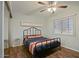 Bedroom with ceiling fan, window, and wood-look floors at 4415 S Poplar St, Tempe, AZ 85282