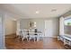 Bright dining room with wood floors and elegant table set with six chairs at 4415 S Poplar St, Tempe, AZ 85282