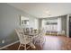 The dining room has hardwood floors, grey walls, white trim and ample natural light at 4415 S Poplar St, Tempe, AZ 85282
