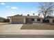 Charming single-story home featuring a two-car garage and desert landscaping at 4415 S Poplar St, Tempe, AZ 85282