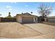 Charming home featuring an attached two-car garage, mature landscaping, and a spacious driveway at 4415 S Poplar St, Tempe, AZ 85282