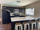 Modern kitchen with stainless appliances, ample cabinet space and a large center island at 4415 S Poplar St, Tempe, AZ 85282