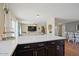 Open kitchen layout features a breakfast bar and view to the Gathering and dining rooms at 4415 S Poplar St, Tempe, AZ 85282