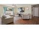 Cozy living room with a comfortable sectional sofa, neutral tones, and wood floors at 4415 S Poplar St, Tempe, AZ 85282