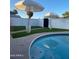 Relaxing pool area with a clean blue pool, privacy wall, and shaded seating at 4415 S Poplar St, Tempe, AZ 85282