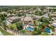 An aerial view of a home with a backyard oasis featuring a pool, sport court, and manicured landscaping at 4463 S Oregon Ct, Chandler, AZ 85248