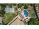 An aerial view showcasing a luxurious backyard with a pool, putting green, basketball court, and ample entertaining space at 4463 S Oregon Ct, Chandler, AZ 85248