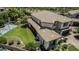 Aerial view of a home featuring a well-manicured lawn, basketball court, and desert landscaping at 4463 S Oregon Ct, Chandler, AZ 85248