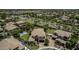 Drone photo showcasing a house with a backyard including a basketball court and beautiful landscaping in a Gathering neighborhood at 4463 S Oregon Ct, Chandler, AZ 85248