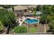 Beautiful backyard features a pool, covered patio, putting green, and lounge chairs, perfect for outdoor enjoyment and relaxation at 4463 S Oregon Ct, Chandler, AZ 85248