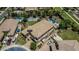 An aerial view highlights a beautiful backyard complete with a pool, sports court, putting green, and ample space at 4463 S Oregon Ct, Chandler, AZ 85248