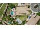 Expansive backyard featuring a lush lawn, sparkling pool, putting green, and basketball court at 4463 S Oregon Ct, Chandler, AZ 85248