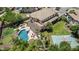 Spacious backyard with a pool, patio, basketball court, and lush landscaping, perfect for outdoor activities and relaxation at 4463 S Oregon Ct, Chandler, AZ 85248