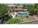 Gorgeous outdoor space with pool, putting green, sport court, covered patio, and mature landscaping at 4463 S Oregon Ct, Chandler, AZ 85248