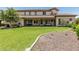 Expansive backyard with manicured lawn, covered patio and lush landscaping offers a great space for relaxation at 4463 S Oregon Ct, Chandler, AZ 85248