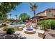 Resort-style backyard features a luxurious pool, spa, fire pit, and outdoor seating area at 4463 S Oregon Ct, Chandler, AZ 85248
