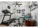Bonus room with exercise equipment, a ceiling fan, and a small dining table at 4463 S Oregon Ct, Chandler, AZ 85248