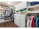 Walk-in closet featuring custom shelving, cabinets, and drawers at 4463 S Oregon Ct, Chandler, AZ 85248