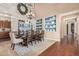Elegant dining area boasts hardwood floors, custom plate shelves, and a stylish chandelier at 4463 S Oregon Ct, Chandler, AZ 85248