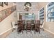 Stylish dining room with a large table, decorative shelving, and elegant chandelier at 4463 S Oregon Ct, Chandler, AZ 85248