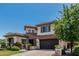 Charming two-story home with a well-maintained front yard and mature trees at 4463 S Oregon Ct, Chandler, AZ 85248