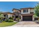 Beautiful two-story stucco home with a brick driveway and manicured landscaping at 4463 S Oregon Ct, Chandler, AZ 85248