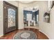 Grand foyer with hardwood floors, a decorative front door, and an open floor plan at 4463 S Oregon Ct, Chandler, AZ 85248