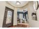 Welcoming foyer with wood floors, an elegant door, and an open view to the office at 4463 S Oregon Ct, Chandler, AZ 85248