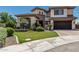 Charming home featuring lush landscaping, a well-maintained lawn, and a paved driveway leading to a spacious garage at 4463 S Oregon Ct, Chandler, AZ 85248