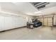 Well-organized garage with ample storage cabinets, overhead racks, and a clean, spacious layout for parking and projects at 4463 S Oregon Ct, Chandler, AZ 85248