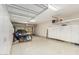 Clean and spacious garage with storage cabinets, overhead racks, and plenty of room for vehicles and projects at 4463 S Oregon Ct, Chandler, AZ 85248