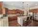 Gourmet kitchen with granite countertops, stainless steel appliances, and custom cabinetry at 4463 S Oregon Ct, Chandler, AZ 85248