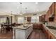 Spacious kitchen featuring stainless steel appliances and an island with granite countertops at 4463 S Oregon Ct, Chandler, AZ 85248