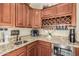 Charming kitchenette features granite countertops, wine rack, sink, and mini fridge at 4463 S Oregon Ct, Chandler, AZ 85248