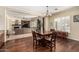 Open-concept living and dining areas with hardwood floors and plantation shutters at 4463 S Oregon Ct, Chandler, AZ 85248