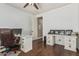 Office area with desk, chair, and wall décor and an open doorway at 4463 S Oregon Ct, Chandler, AZ 85248
