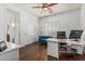 Bright home office featuring wood floors, a ceiling fan, and a comfortable seating area at 4463 S Oregon Ct, Chandler, AZ 85248