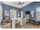 Bright office featuring blue walls, a ceiling fan, and multiple desks for working at 4463 S Oregon Ct, Chandler, AZ 85248