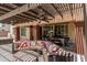 Stylish outdoor living area featuring a pergola, ceiling fans, and a dining area at 4463 S Oregon Ct, Chandler, AZ 85248