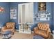Cozy reading room with comfortable armchairs, bookshelves, and natural light at 4463 S Oregon Ct, Chandler, AZ 85248