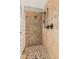 Shower featuring mosaic tile flooring and bronze fixtures at 4463 S Oregon Ct, Chandler, AZ 85248