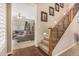 Hallway view of carpeted stairs with dark wood handrail leading to a living area at 4463 S Oregon Ct, Chandler, AZ 85248